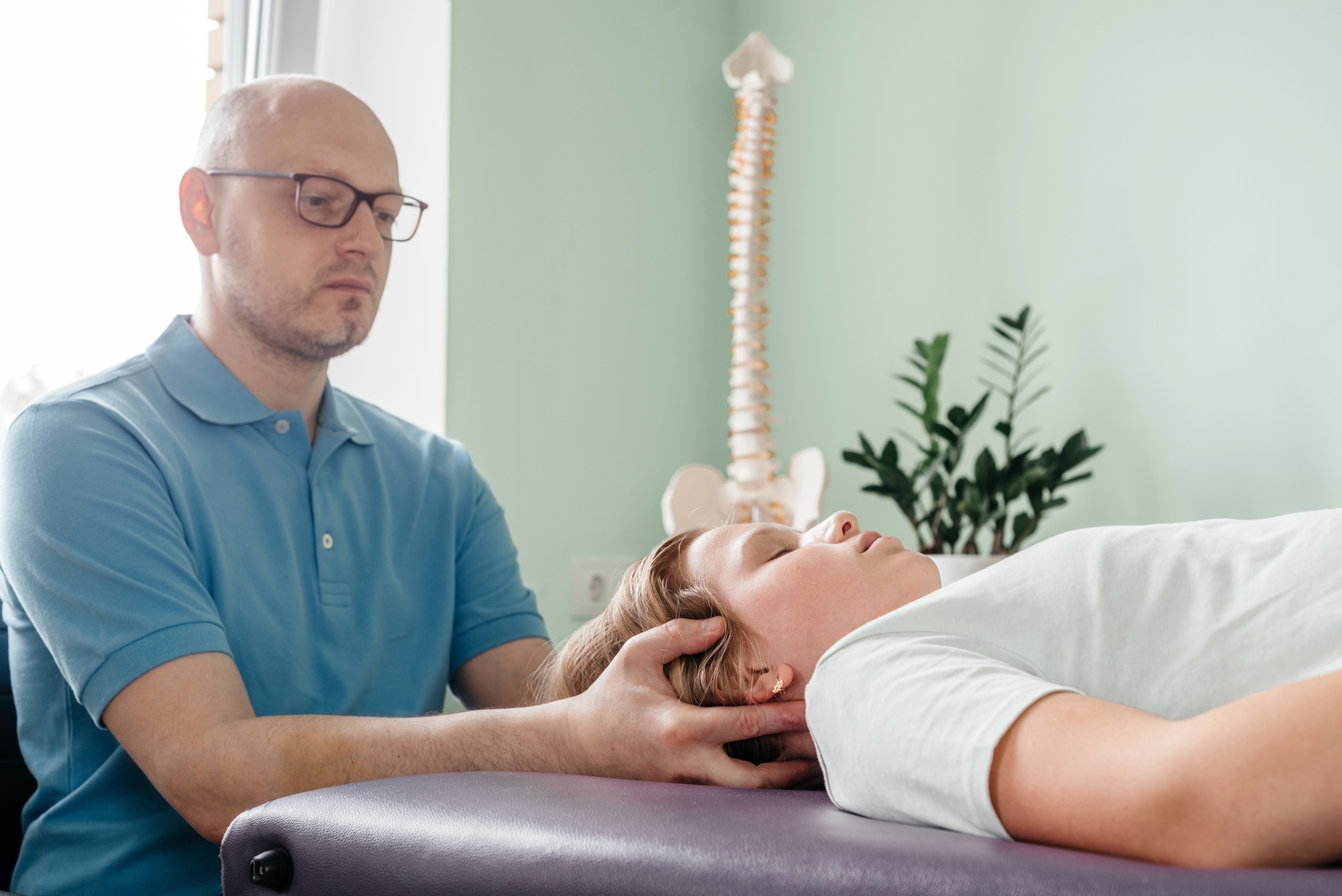 A girl receiving CST treatment, Osteopathic Manipulation and CranioSacral Therapy for children